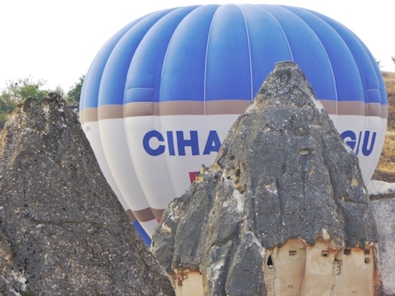 cappadocia-hot-air-balloon-next-to-fairy-chimneys