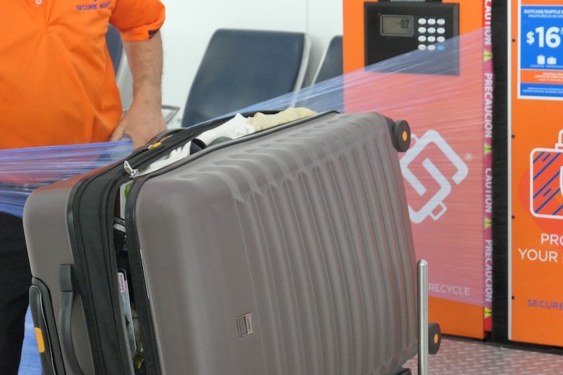 shrink-wrap-broken-suitcase