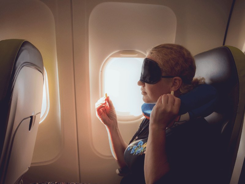 sleeping-on-a-plane-with-sleep-mask
