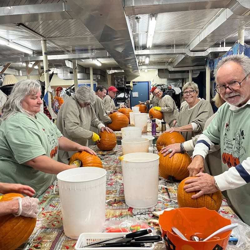volunteers-carving-pumpkins-mahone-bay-scarecrow-festival