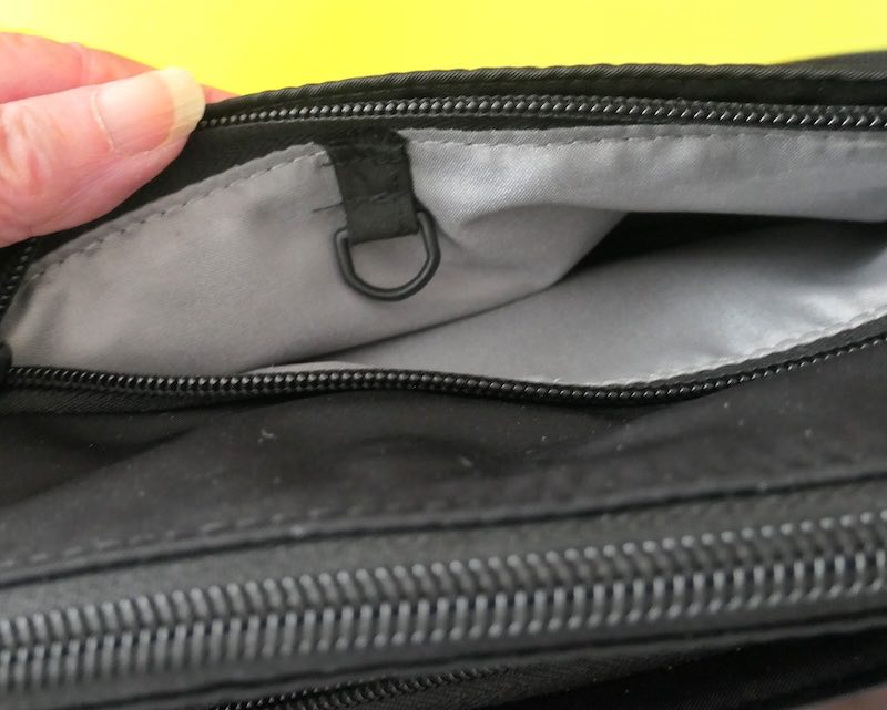 d-ring-added-to-back-pocket-of-travel-purse-to-improve-security